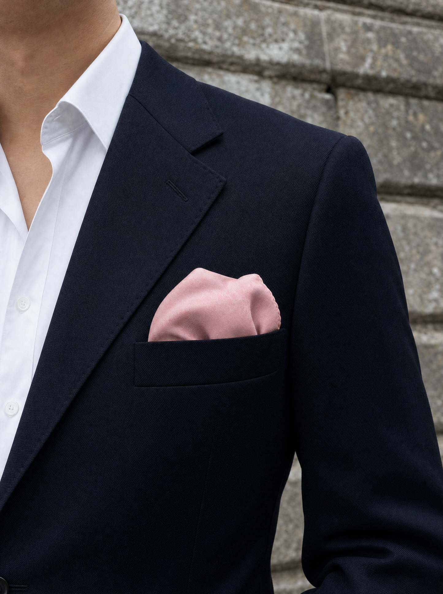 The Festive Pink Silk Pocket Square folded in a suit breast pocket — men's silk pocket square