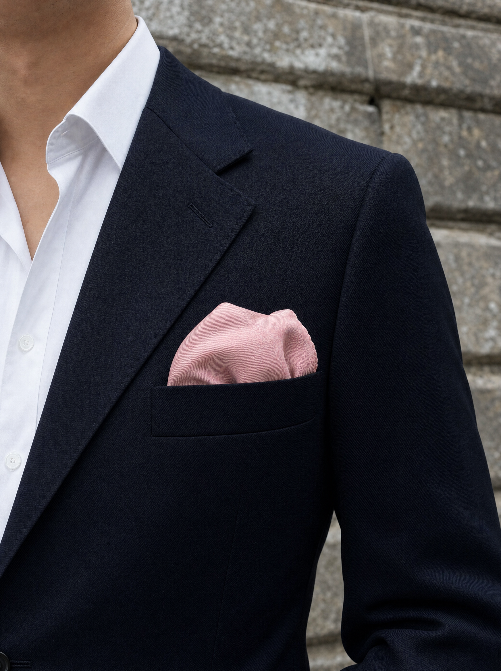 The Festive Pink Silk Pocket Square folded in a suit breast pocket — men's silk pocket square
